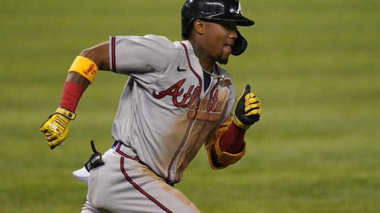 Jun 11, 2021; Miami, Florida, USA; Atlanta Braves right fielder Ronald Acuna Jr. (13) runs the bases for a double in the 3rd inning against the Miami Marlins at loanDepot park. Mandatory Credit: Jasen Vinlove-USA TODAY Sports