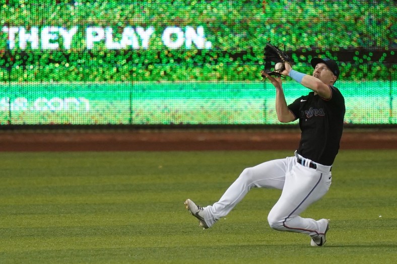 Jun 11, 2021; Miami, Florida, USA; Miami Marlins left fielder Corey Dickerson (23) catches the fly ball of Atlanta Braves shortstop Dansby Swanson (not pictured) in the 3rd inning at loanDepot park. Mandatory Credit: Jasen Vinlove-USA TODAY Sports