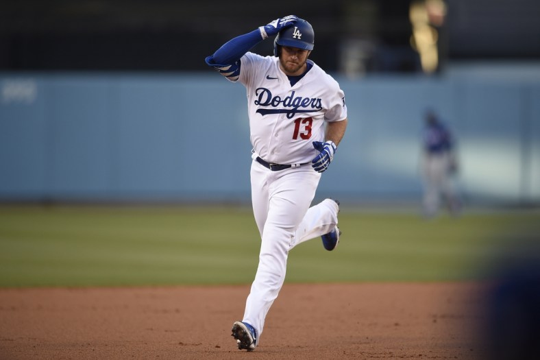 Jun 11, 2021; Los Angeles, California, USA; Los Angeles Dodgers first baseman Max Muncy (13) rounds the bases after a two-run home run during the first inning against the Texas Rangers at Dodger Stadium. Mandatory Credit: Kelvin Kuo-USA TODAY Sports