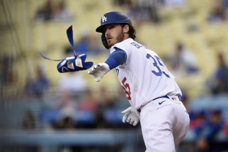 Jun 11, 2021; Los Angeles, California, USA; Los Angeles Dodgers center fielder Cody Bellinger (35) tosses his pad after being walked during the first inning against the Texas Rangers at Dodger Stadium. Mandatory Credit: Kelvin Kuo-USA TODAY Sports
