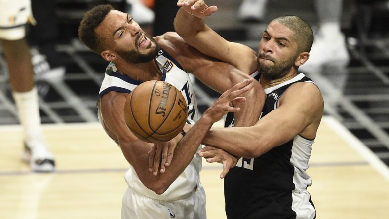 Jun 12, 2021; Los Angeles, California, USA; LA Clippers forward Nicolas Batum (33) fouls Utah Jazz center Rudy Gobert (27) on a shot attempt in the third quarter during game three in the second round of the 2021 NBA Playoffs. at Staples Center. Mandatory Credit: Kelvin Kuo-USA TODAY Sports