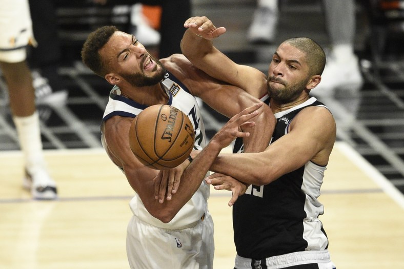 Jun 12, 2021; Los Angeles, California, USA; LA Clippers forward Nicolas Batum (33) fouls Utah Jazz center Rudy Gobert (27) on a shot attempt in the third quarter during game three in the second round of the 2021 NBA Playoffs. at Staples Center. Mandatory Credit: Kelvin Kuo-USA TODAY Sports
