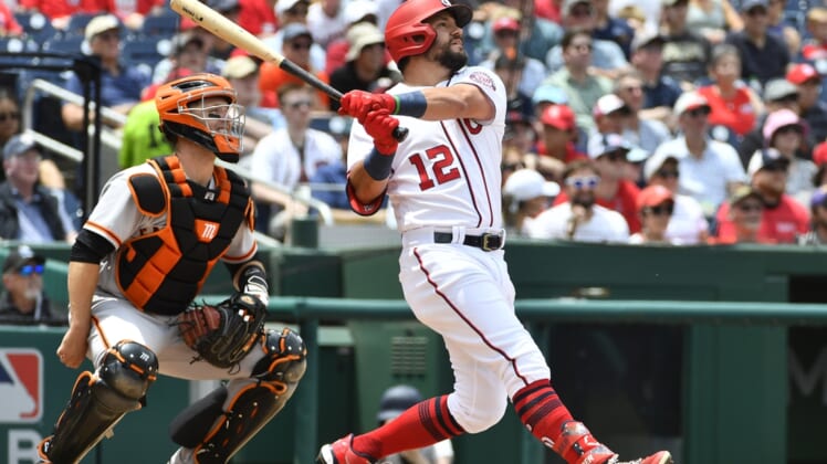 Jun 13, 2021; Washington, District of Columbia, USA; Washington Nationals left fielder Kyle Schwarber (12) hits a three run home run against the San Francisco Giants during the second inning at Nationals Park. Mandatory Credit: Brad Mills-USA TODAY Sports