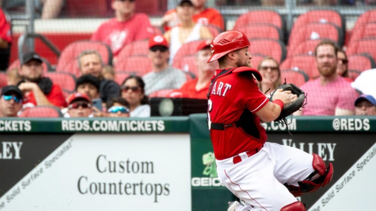 Cincinnati Reds catcher Tucker Barnhart (16) catches a foul ball in the second inning of the MLB game between Cincinnati Reds and Colorado Rockies at Great American Ball Park on Sunday, June 13, 2021, in downtown Cincinnati.Cincinnati Reds Colorado Rockies