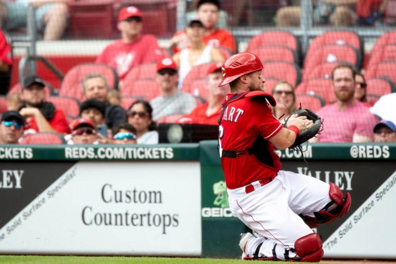 Cincinnati Reds catcher Tucker Barnhart (16) catches a foul ball in the second inning of the MLB game between Cincinnati Reds and Colorado Rockies at Great American Ball Park on Sunday, June 13, 2021, in downtown Cincinnati.

Cincinnati Reds Colorado Rockies