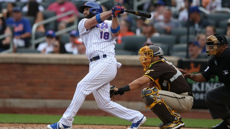 Jun 13, 2021; New York City, New York, USA; New York Mets second baseman Jose Peraza (18) follows through on a two run home run against the San Diego Padres during the fifth inning at Citi Field. Mandatory Credit: Brad Penner-USA TODAY Sports