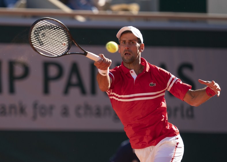 Jun 13, 2021; Paris, France; Novak Djokovic (SRB) in action during the men's final against Stefanos Tsitsipas (GRE) on day 15 of the French Open at Stade Roland Garros. Mandatory Credit: Susan Mullane-USA TODAY Sports