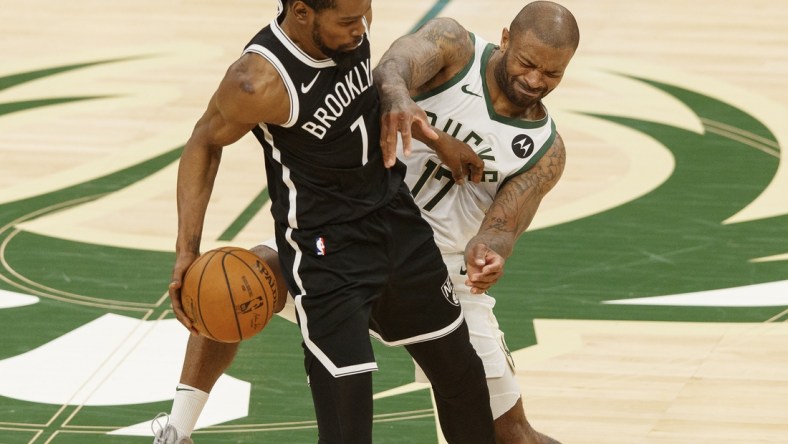 Jun 13, 2021; Milwaukee, Wisconsin, USA;  Milwaukee Bucks forward P.J. Tucker (17) defends Brooklyn Nets forward Kevin Durant (7) during the third quarter during game four in the second round of the 2021 NBA Playoffs. at Fiserv Forum. Mandatory Credit: Jeff Hanisch-USA TODAY Sports