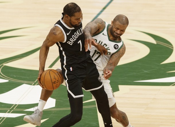 Jun 13, 2021; Milwaukee, Wisconsin, USA;  Milwaukee Bucks forward P.J. Tucker (17) defends Brooklyn Nets forward Kevin Durant (7) during the third quarter during game four in the second round of the 2021 NBA Playoffs. at Fiserv Forum. Mandatory Credit: Jeff Hanisch-USA TODAY Sports