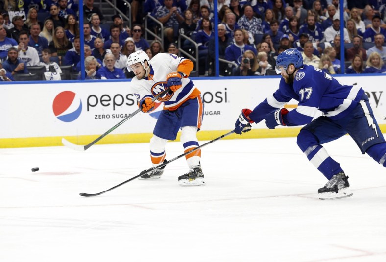 Jun 13, 2021; Tampa, Florida, USA; New York Islanders center Mathew Barzal (13) shoot as Tampa Bay Lightning defenseman Victor Hedman (77) defends during the second period in game one of the 2021 Stanley Cup Semifinals at Amalie Arena. Mandatory Credit: Kim Klement-USA TODAY Sports