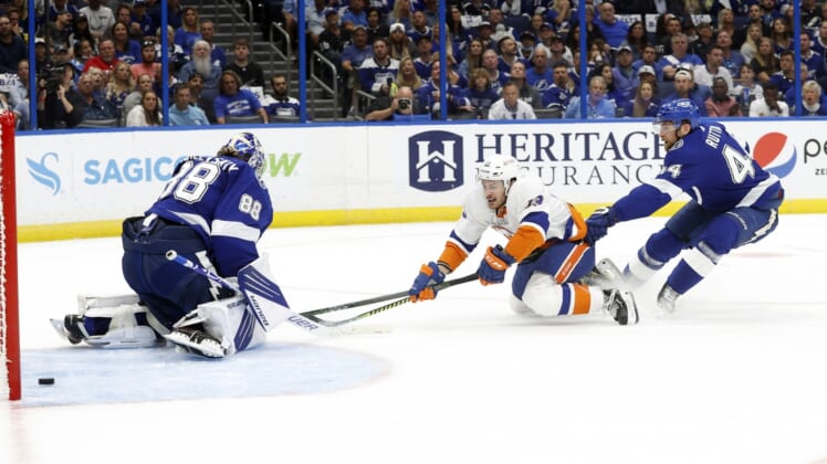 Jun 13, 2021; Tampa, Florida, USA; New York Islanders center Mathew Barzal (13) scores a goal on Tampa Bay Lightning goaltender Andrei Vasilevskiy (88) as defenseman Jan Rutta (44) attempted to defend during the second period in game one of the 2021 Stanley Cup Semifinals at Amalie Arena. Mandatory Credit: Kim Klement-USA TODAY Sports
