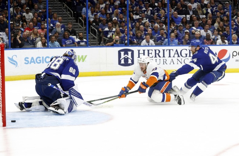 Jun 13, 2021; Tampa, Florida, USA; New York Islanders center Mathew Barzal (13) scores a goal on Tampa Bay Lightning goaltender Andrei Vasilevskiy (88) as defenseman Jan Rutta (44) attempted to defend during the second period in game one of the 2021 Stanley Cup Semifinals at Amalie Arena. Mandatory Credit: Kim Klement-USA TODAY Sports