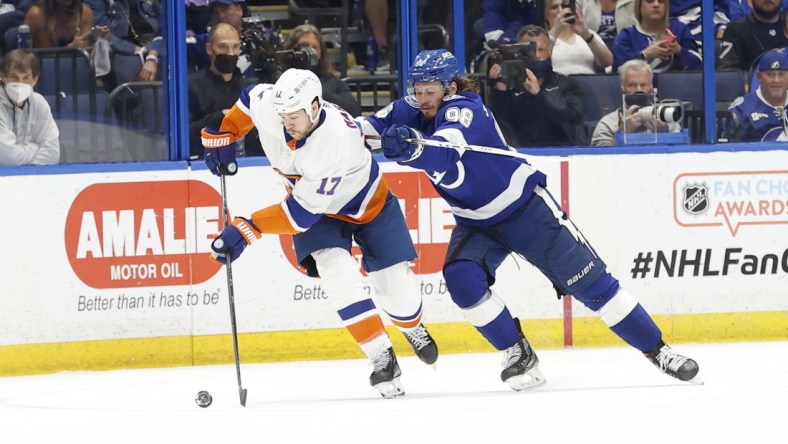 Jun 13, 2021; Tampa, Florida, USA; New York Islanders left wing Matt Martin (17) skates with the puck as Tampa Bay Lightning defenseman Mikhail Sergachev (98) defends during the third period in game one of the 2021 Stanley Cup Semifinals at Amalie Arena. Mandatory Credit: Kim Klement-USA TODAY Sports