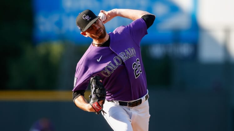 Jun 14, 2021; Denver, Colorado, USA; Colorado Rockies starting pitcher Austin Gomber (26) pitches in the first inning against the San Diego Padres at Coors Field. Mandatory Credit: Isaiah J. Downing-USA TODAY Sports
