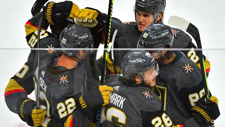 Jun 14, 2021; Las Vegas, Nevada, USA; Vegas Golden Knights center Mattias Janmark (26) celebrates with team mates after scoring a second period goal against the Montreal Canadiens in game one of the 2021 Stanley Cup Semifinals at T-Mobile Arena. Mandatory Credit: Stephen R. Sylvanie-USA TODAY Sports