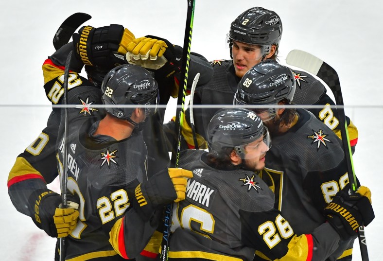 Jun 14, 2021; Las Vegas, Nevada, USA; Vegas Golden Knights center Mattias Janmark (26) celebrates with team mates after scoring a second period goal against the Montreal Canadiens in game one of the 2021 Stanley Cup Semifinals at T-Mobile Arena. Mandatory Credit: Stephen R. Sylvanie-USA TODAY Sports