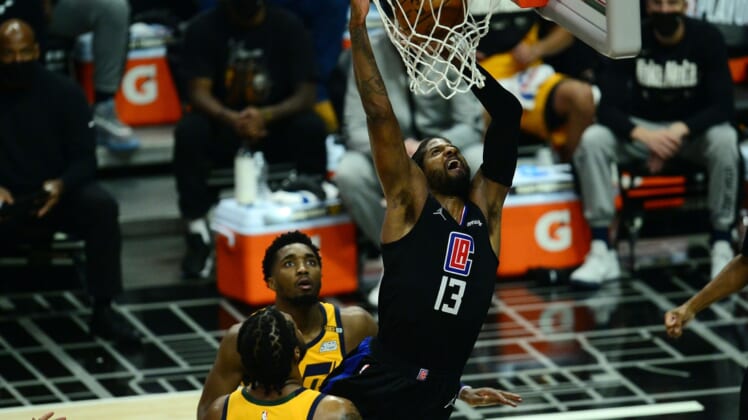Jun 14, 2021; Los Angeles, California, USA; Los Angeles Clippers guard Paul George (13) scores a basket against the Utah Jazz during the first half in game four in the second round of the 2021 NBA Playoffs. at Staples Center. Mandatory Credit: Gary A. Vasquez-USA TODAY Sports