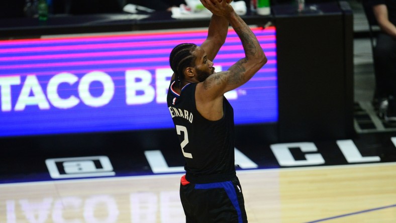 Jun 14, 2021; Los Angeles, California, USA; Los Angeles Clippers forward Kawhi Leonard (2) shoots against the Utah Jazz during the first half in game four in the second round of the 2021 NBA Playoffs. at Staples Center. Mandatory Credit: Gary A. Vasquez-USA TODAY Sports