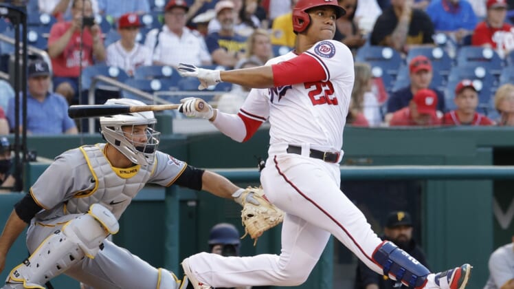 Jun 15, 2021; Washington, District of Columbia, USA; Washington Nationals left fielder Juan Soto (22) singles against the Pittsburgh Pirates in the first inning at Nationals Park. Mandatory Credit: Geoff Burke-USA TODAY Sports