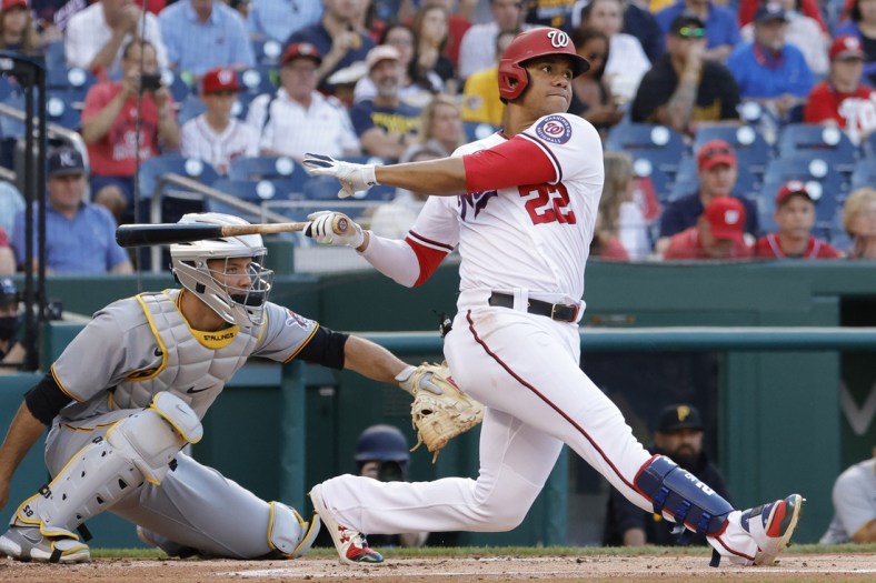 Jun 15, 2021; Washington, District of Columbia, USA; Washington Nationals left fielder Juan Soto (22) singles against the Pittsburgh Pirates in the first inning at Nationals Park. Mandatory Credit: Geoff Burke-USA TODAY Sports
