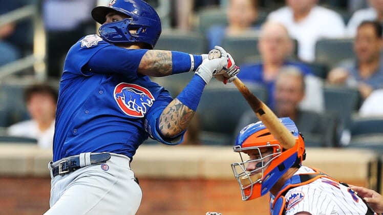 Jun 15, 2021; New York City, New York, USA; Chicago Cubs shortstop Javier Baez (9) hits a two run home run against the New York Mets during the third inning at Citi Field. Mandatory Credit: Andy Marlin-USA TODAY Sports
