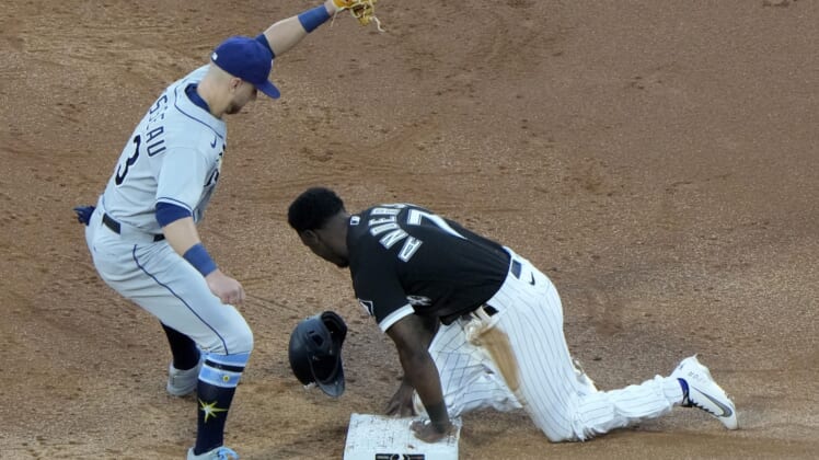 Jun 15, 2021; Chicago, Illinois, USA; Chicago White Sox shortstop Tim Anderson (7) slides safely against Tampa Bay Rays third baseman Mike Brosseau (43) during the third inning at Guaranteed Rate Field. Mandatory Credit: Mike Dinovo-USA TODAY Sports