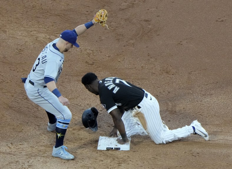 Jun 15, 2021; Chicago, Illinois, USA; Chicago White Sox shortstop Tim Anderson (7) slides safely against Tampa Bay Rays third baseman Mike Brosseau (43) during the third inning at Guaranteed Rate Field. Mandatory Credit: Mike Dinovo-USA TODAY Sports