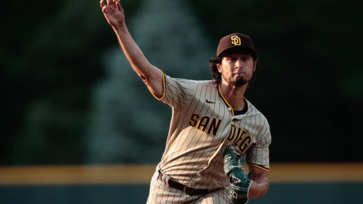 Jun 15, 2021; Denver, Colorado, USA; San Diego Padres starting pitcher Yu Darvish (11) pitches in the first inning against the Colorado Rockies at Coors Field. Mandatory Credit: Isaiah J. Downing-USA TODAY Sports