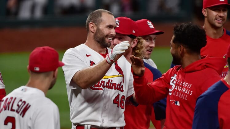 Jun 15, 2021; St. Louis, Missouri, USA;  St. Louis Cardinals first baseman Paul Goldschmidt (46) is congratulated by teammates at home plate after hitting a walk off solo home run during the ninth inning against the Miami Marlins at Busch Stadium. Mandatory Credit: Jeff Curry-USA TODAY Sports