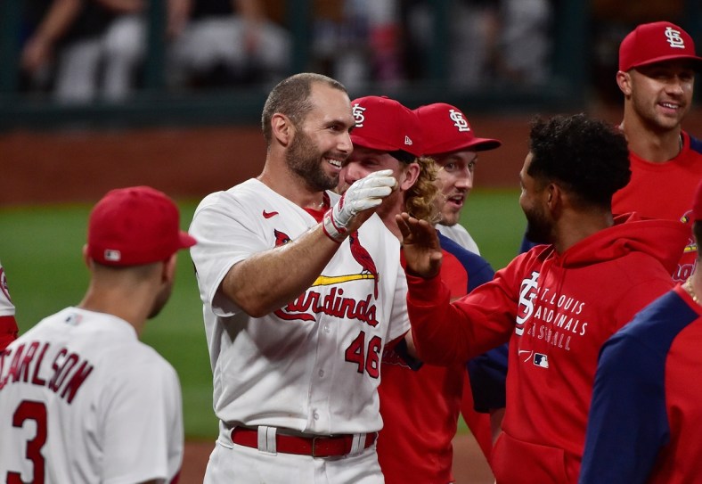 Jun 15, 2021; St. Louis, Missouri, USA;  St. Louis Cardinals first baseman Paul Goldschmidt (46) is congratulated by teammates at home plate after hitting a walk off solo home run during the ninth inning against the Miami Marlins at Busch Stadium. Mandatory Credit: Jeff Curry-USA TODAY Sports