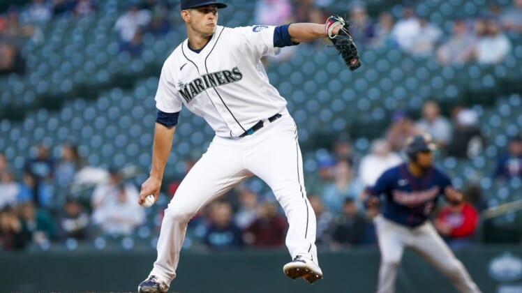 Jun 15, 2021; Seattle, Washington, USA; Seattle Mariners starting pitcher Chris Flexen (77) throws against the Minnesota Twins during the fourth inning at T-Mobile Park. Mandatory Credit: Joe Nicholson-USA TODAY Sports