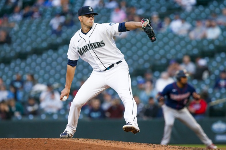 Jun 15, 2021; Seattle, Washington, USA; Seattle Mariners starting pitcher Chris Flexen (77) throws against the Minnesota Twins during the fourth inning at T-Mobile Park. Mandatory Credit: Joe Nicholson-USA TODAY Sports