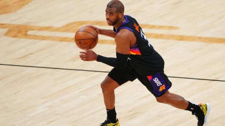 Jun 9, 2021; Phoenix, Arizona, USA; Phoenix Suns guard Chris Paul (3) against the Denver Nuggets during game two in the second round of the 2021 NBA Playoffs at Phoenix Suns Arena. Mandatory Credit: Mark J. Rebilas-USA TODAY Sports
