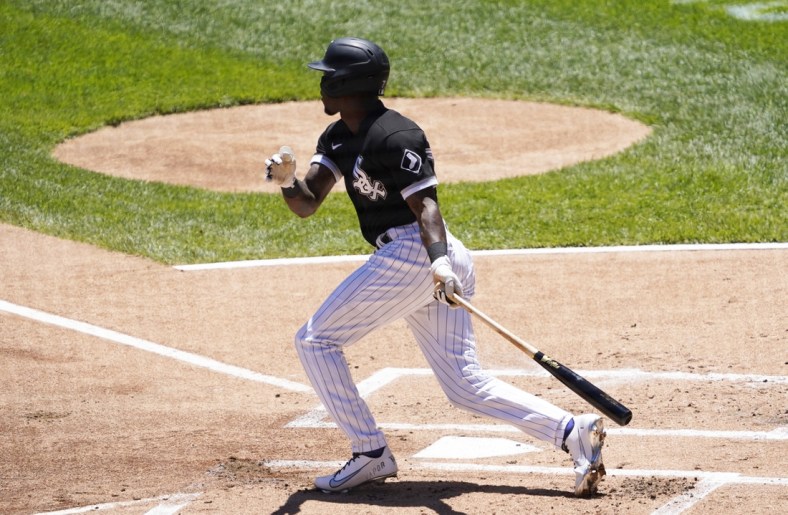 Jun 16, 2021; Chicago, Illinois, USA; Chicago White Sox shortstop Tim Anderson (7) hits a single against the Tampa Bay Rays during the first inning at Guaranteed Rate Field. Mandatory Credit: David Banks-USA TODAY Sports