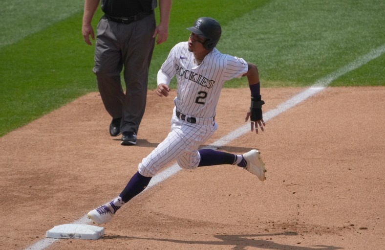 Jun 16, 2021; Denver, Colorado, USA; Colorado Rockies center fielder Yonathan Daza (2) rounds third base on his way to score in the fourth inning against the San Diego Padres at Coors Field. Mandatory Credit: Ron Chenoy-USA TODAY Sports