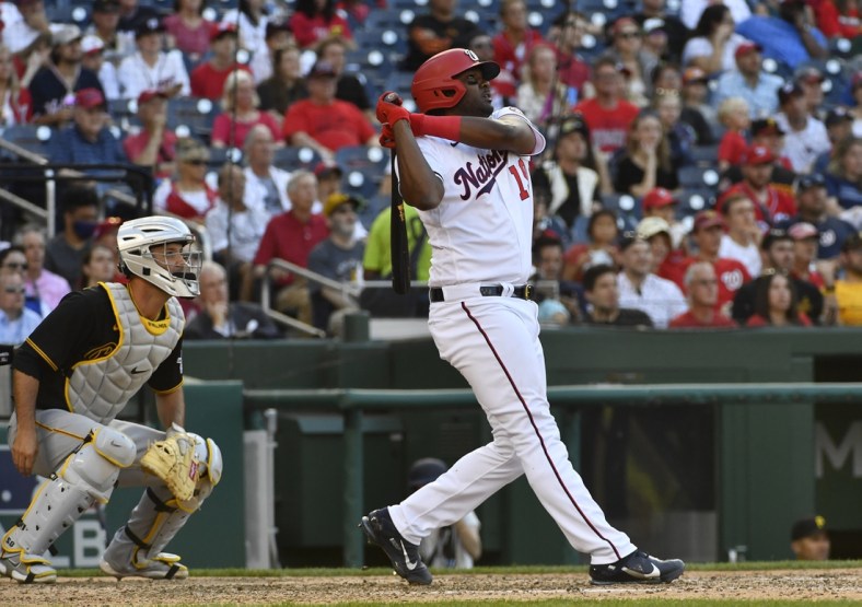 Jun 16, 2021; Washington, District of Columbia, USA; Washington Nationals first baseman Josh Bell (19) hits a two-run home run against the Pittsburgh Pirates during the seventh inning at Nationals Park. Mandatory Credit: Brad Mills-USA TODAY Sports