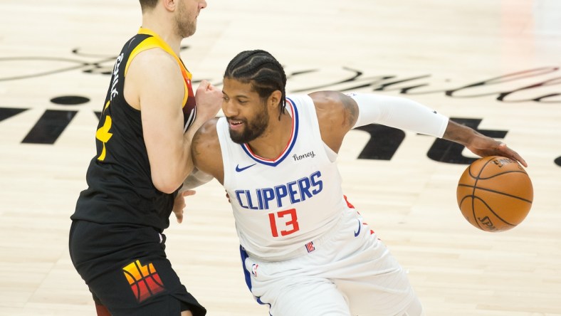 Jun 16, 2021; Salt Lake City, Utah, USA; LA Clippers guard Paul George (13) dribbles the ball against Utah Jazz forward Bojan Bogdanovic (44) during the first quarter of game five in the second round of the 2021 NBA Playoffs at Vivint Arena. Mandatory Credit: Russell Isabella-USA TODAY Sports