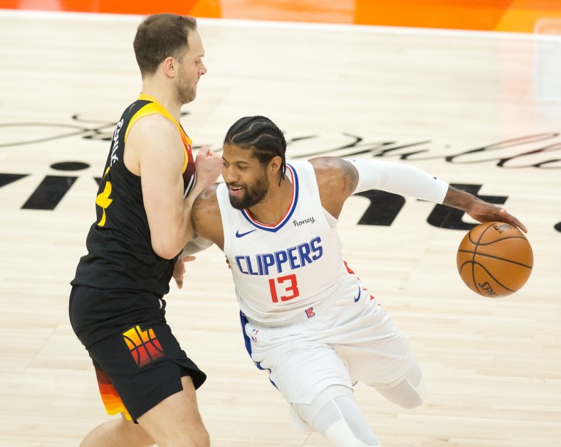 Jun 16, 2021; Salt Lake City, Utah, USA; LA Clippers guard Paul George (13) dribbles the ball against Utah Jazz forward Bojan Bogdanovic (44) during the first quarter of game five in the second round of the 2021 NBA Playoffs at Vivint Arena. Mandatory Credit: Russell Isabella-USA TODAY Sports