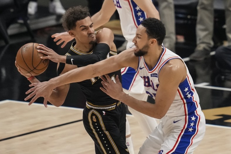 Jun 18, 2021; Atlanta, Georgia, USA; Atlanta Hawks guard Trae Young (11) works against Philadelphia 76ers guard Ben Simmons (25) during the first quarter in game six in the second round of the 2021 NBA Playoffs. at State Farm Arena. Mandatory Credit: Dale Zanine-USA TODAY Sports