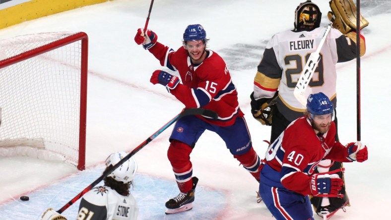 Jun 18, 2021; Montreal, Quebec, CAN; Montreal Canadiens center Jesperi Kotkaniemi (15) and right wing Joel Armia (40) celebrate a goal by right wing Josh Anderson (not pictured) against Vegas Golden Knights goaltender Marc-Andre Fleury (29) during the third period in game three of the 2021 Stanley Cup Semifinals at Bell Centre. Mandatory Credit: Jean-Yves Ahern-USA TODAY Sports