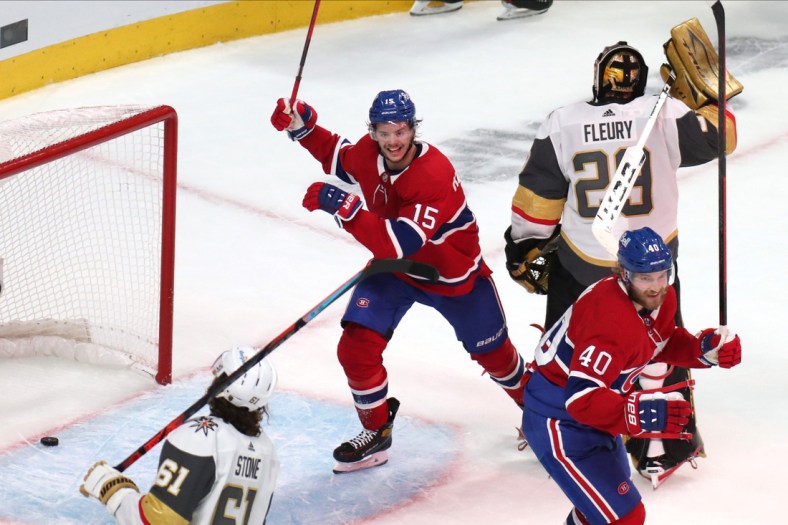 Jun 18, 2021; Montreal, Quebec, CAN; Montreal Canadiens center Jesperi Kotkaniemi (15) and right wing Joel Armia (40) celebrate a goal by right wing Josh Anderson (not pictured) against Vegas Golden Knights goaltender Marc-Andre Fleury (29) during the third period in game three of the 2021 Stanley Cup Semifinals at Bell Centre. Mandatory Credit: Jean-Yves Ahern-USA TODAY Sports