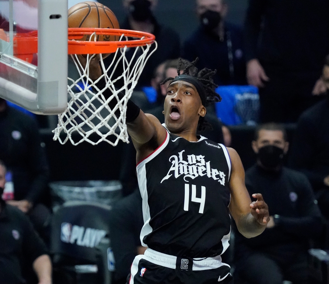 Jun 18, 2021; Los Angeles, California, USA; LA Clippers guard Terance Mann (14) scores on a breakaway during the third quarter of game six in the second round of the 2021 NBA Playoffs against the Utah Jazz at Staples Center. Mandatory Credit: Robert Hanashiro-USA TODAY Sports