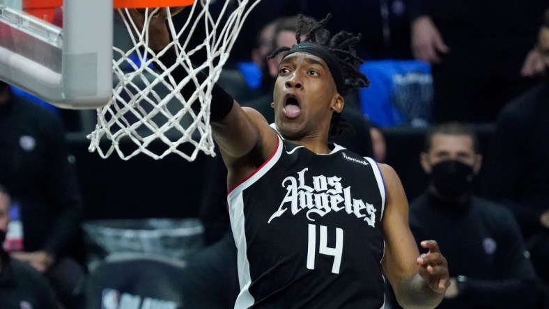 Jun 18, 2021; Los Angeles, California, USA; LA Clippers guard Terance Mann (14) scores on a breakaway during the third quarter of game six in the second round of the 2021 NBA Playoffs against the Utah Jazz at Staples Center. Mandatory Credit: Robert Hanashiro-USA TODAY Sports