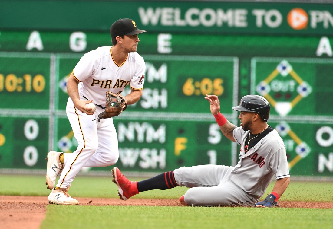 Jun 19, 2021; Pittsburgh, Pennsylvania, USA;  Pittsburgh Pirates second baseman Adam Frazier forces out Cleveland Indians base runner Eddie Rosario rduring the fourth inning at PNC Park. Mandatory Credit: Philip G. Pavely-USA TODAY Sports