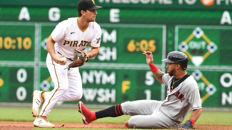 Jun 19, 2021; Pittsburgh, Pennsylvania, USA;  Pittsburgh Pirates second baseman Adam Frazier forces out Cleveland Indians base runner Eddie Rosario rduring the fourth inning at PNC Park. Mandatory Credit: Philip G. Pavely-USA TODAY Sports