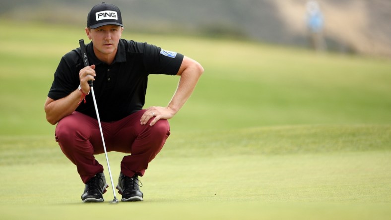 Jun 19, 2021; San Diego, California, USA; Mackenzie Hughes lines up a putt on the fourth green during the third round of the U.S. Open golf tournament at Torrey Pines Golf Course. Mandatory Credit: Orlando Ramirez-USA TODAY Sports