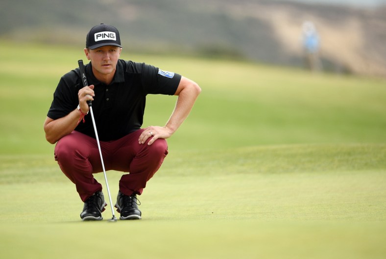 Jun 19, 2021; San Diego, California, USA; Mackenzie Hughes lines up a putt on the fourth green during the third round of the U.S. Open golf tournament at Torrey Pines Golf Course. Mandatory Credit: Orlando Ramirez-USA TODAY Sports