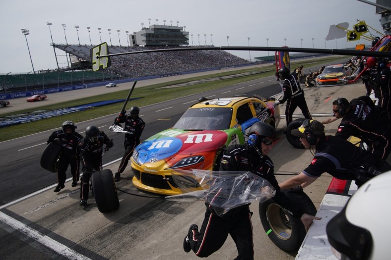 The pit crew for NASCAR Xfinity Series driver Kyle Busch (54) spring into action during the Tennessee Lottery 250 NASCAR Xfinity Series race at the Nashville Superspeedway in Lebanon, Tenn., Saturday, June 19, 2021.

Nascar X 033