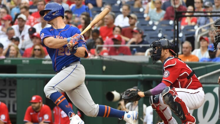 Jun 19, 2021; Washington, District of Columbia, USA; New York Mets first baseman Pete Alonso (20) hits a single against the Washington Nationals during the fourth inning at Nationals Park. Mandatory Credit: Brad Mills-USA TODAY Sports