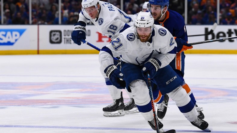 Jun 19, 2021; Uniondale, New York, USA; Tampa Bay Lightning center Brayden Point (21) skates across the blue line against the New York Islanders during the third period in game four of the 2021 Stanley Cup Semifinals at Nassau Veterans Memorial Coliseum. Mandatory Credit: Dennis Schneidler-USA TODAY Sports